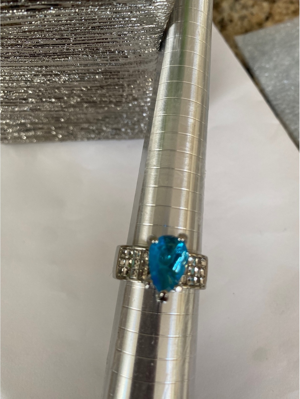 Silver Tone Ring with Pear-Shaped Blue Gemstone and Clear CZ